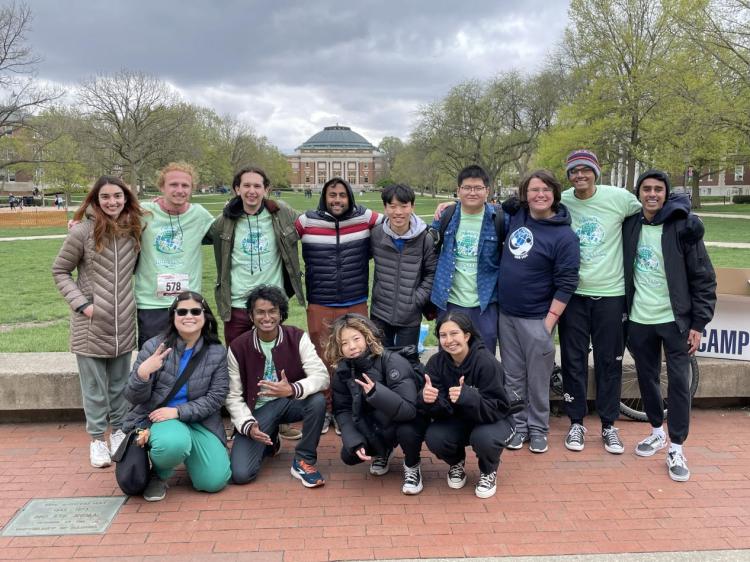 Group photo of EWB-UIUC members, some of whom are wearing Stride for Sustainability shirts